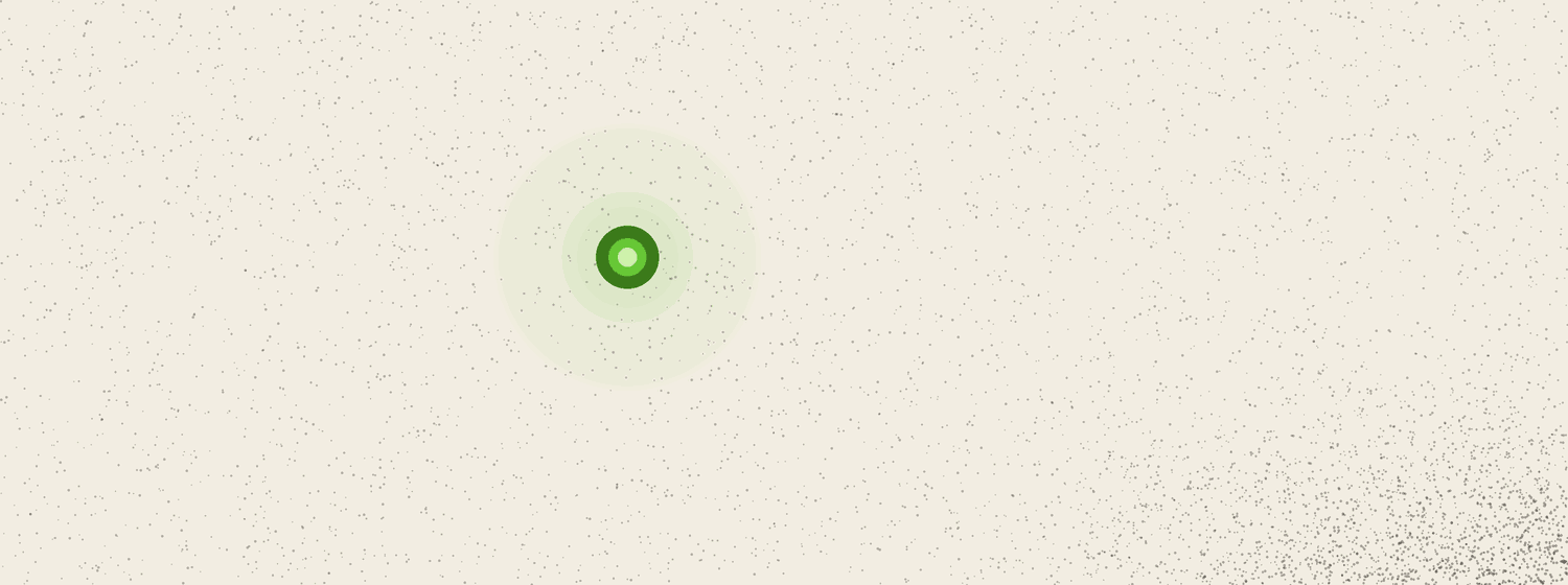 An almost entirely empty field of paper with only a faint residue of dots drifting off one corner and a single steady green light standing alone.